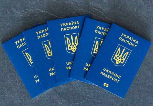 ukraine-passports-stacked-ukrainian-biometric-passport-emigration-concept